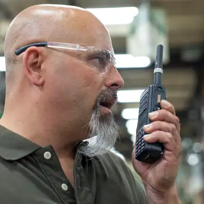 Man Talking on Motorola Radio