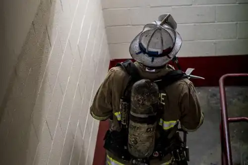 firefighter climbing stairs